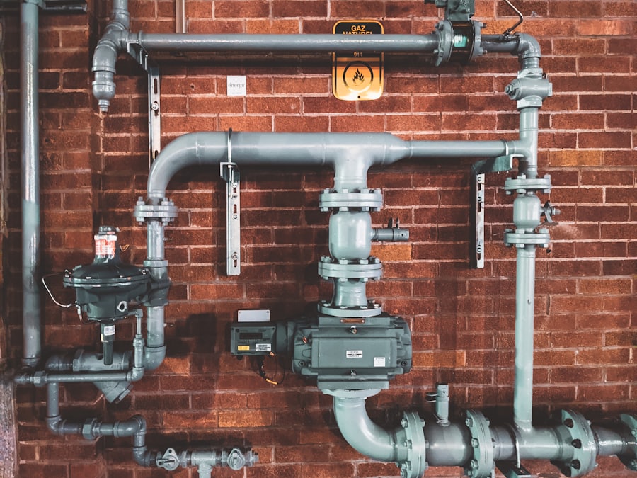 Pipework and isolating valves running up a wall